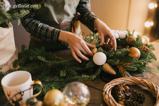 Festive Christmas flower arrangements and greenery decorating a home for the holiday season